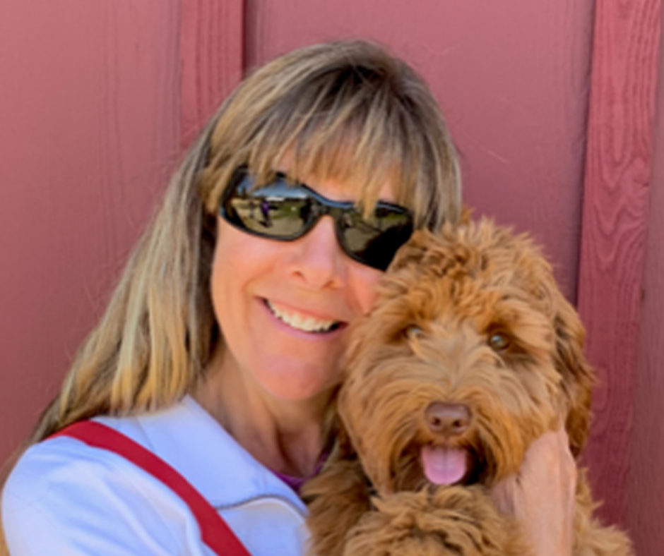 Dog trainer Lisadawn Shackleford holding her dog