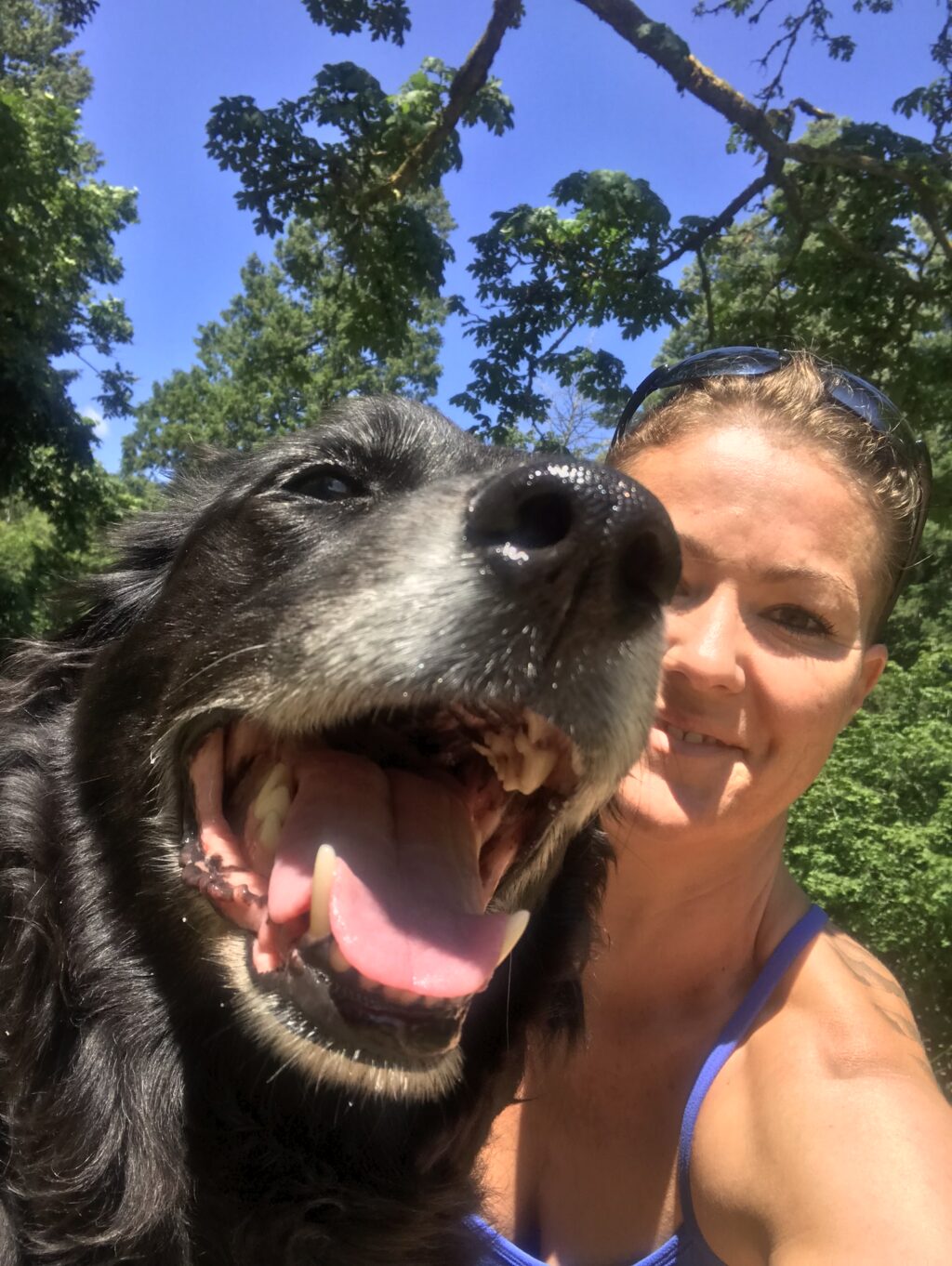 Dog trainer Bianca Steinmetz with her dog on a hike taking a selfie