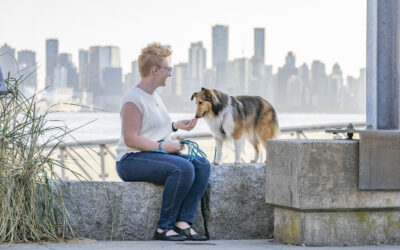 Kaeli Grotz with sheltie Freya with city view of Vancouver